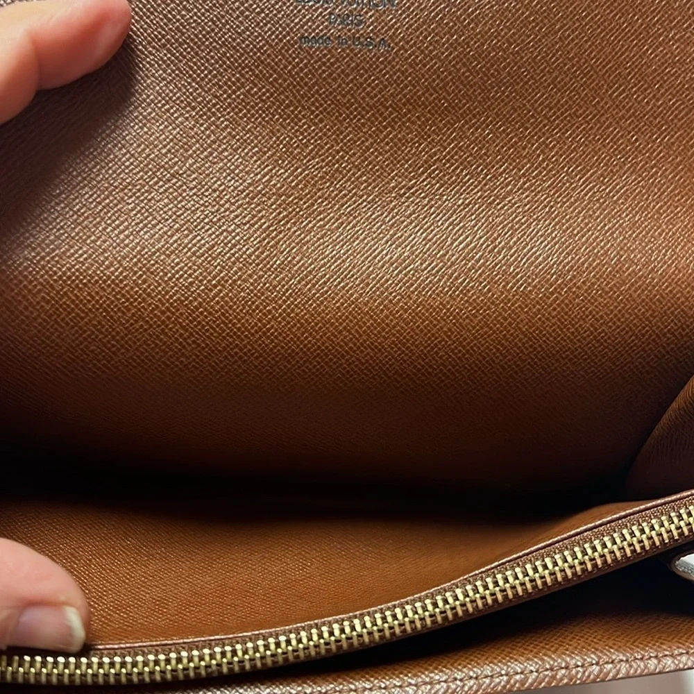 Louis Vuitton monogram sara long wallet.